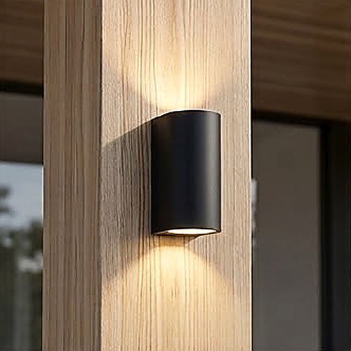 Body 2, the curved face, 8 x 6.8 x 15 cm and outdoor rated, on vertical timber cladding at dusk