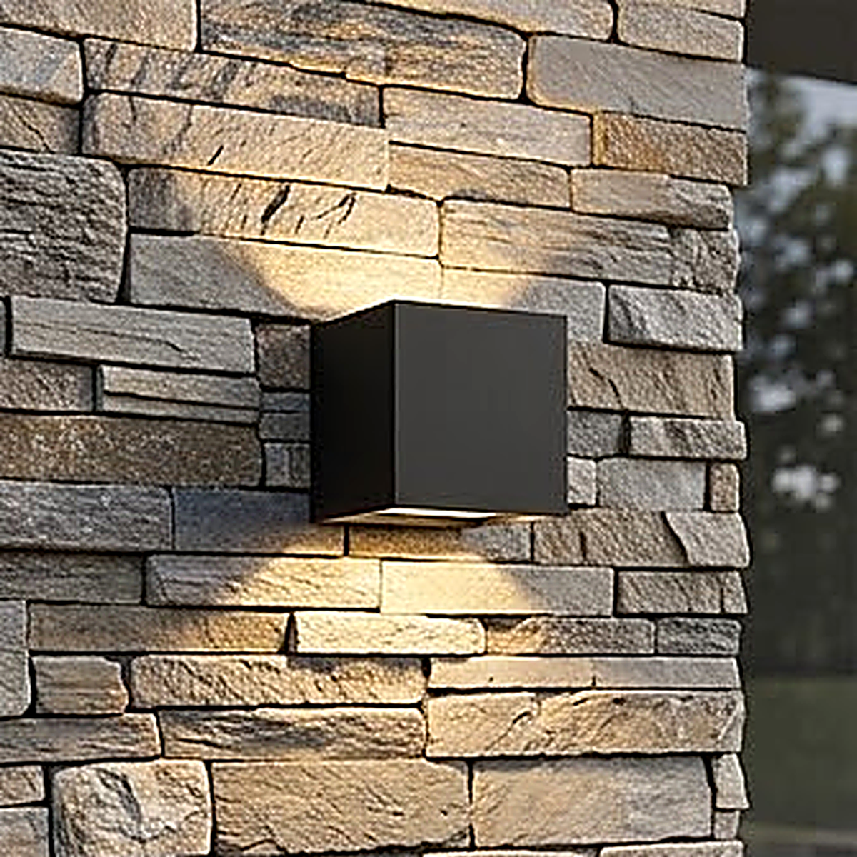 Body 4, the cube, 10 x 10 x 10 cm and outdoor rated, on a stacked stone pillar