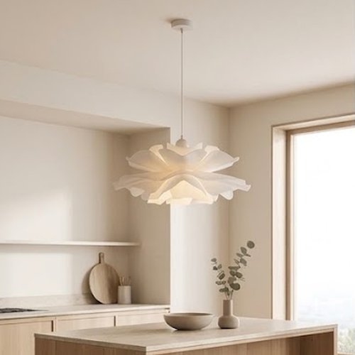 White layered petal pendant light hanging above a pale oak kitchen island