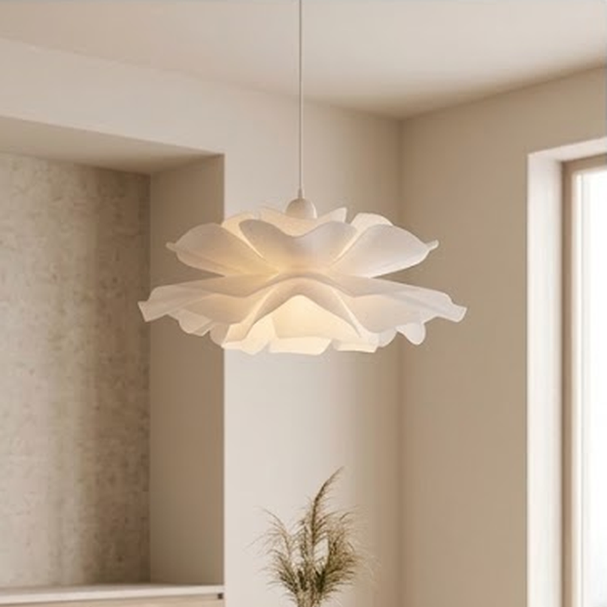 Petal pendant light hanging over a white dining table in a bright room