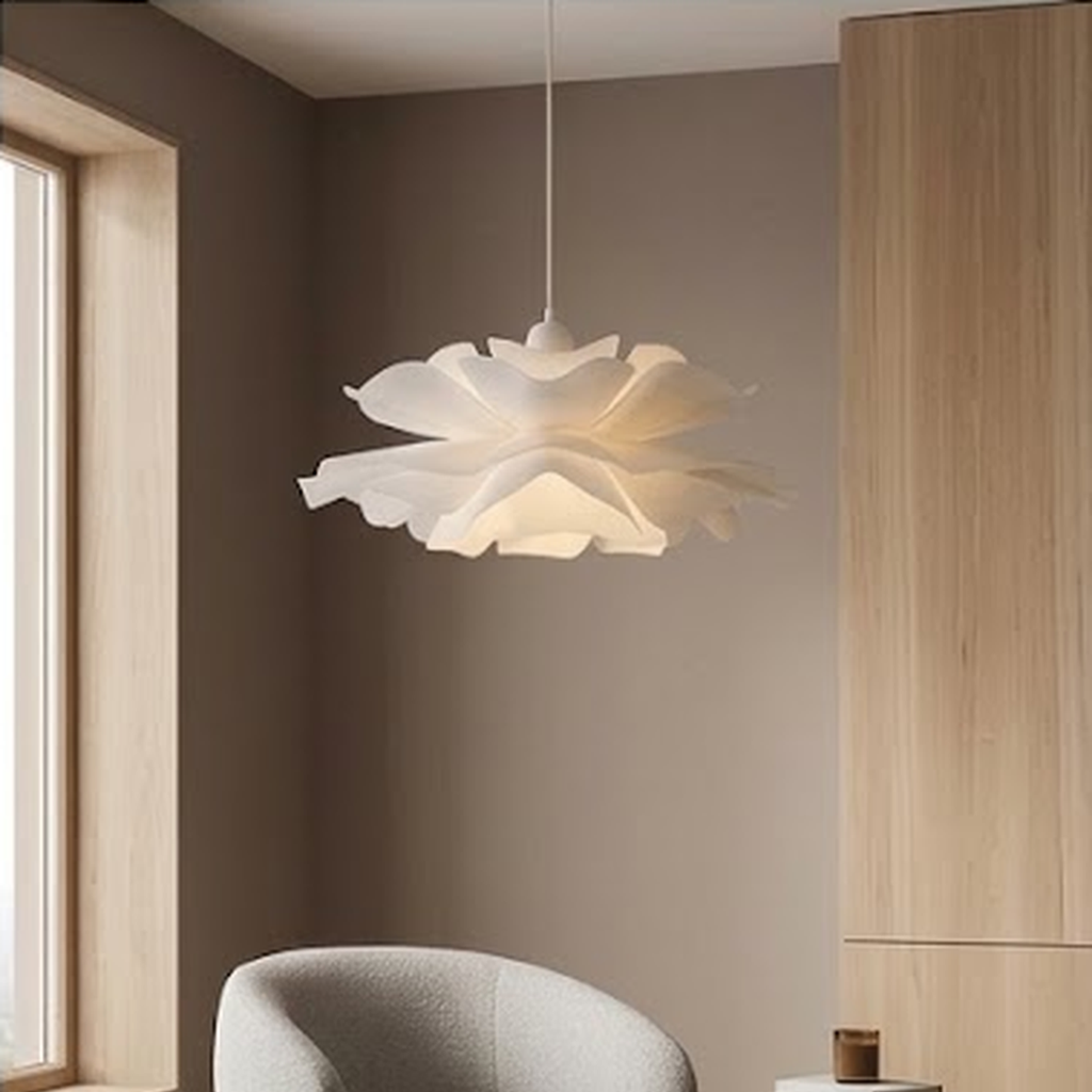 Petal pendant lit in a corner with a boucle armchair and oak cabinetry