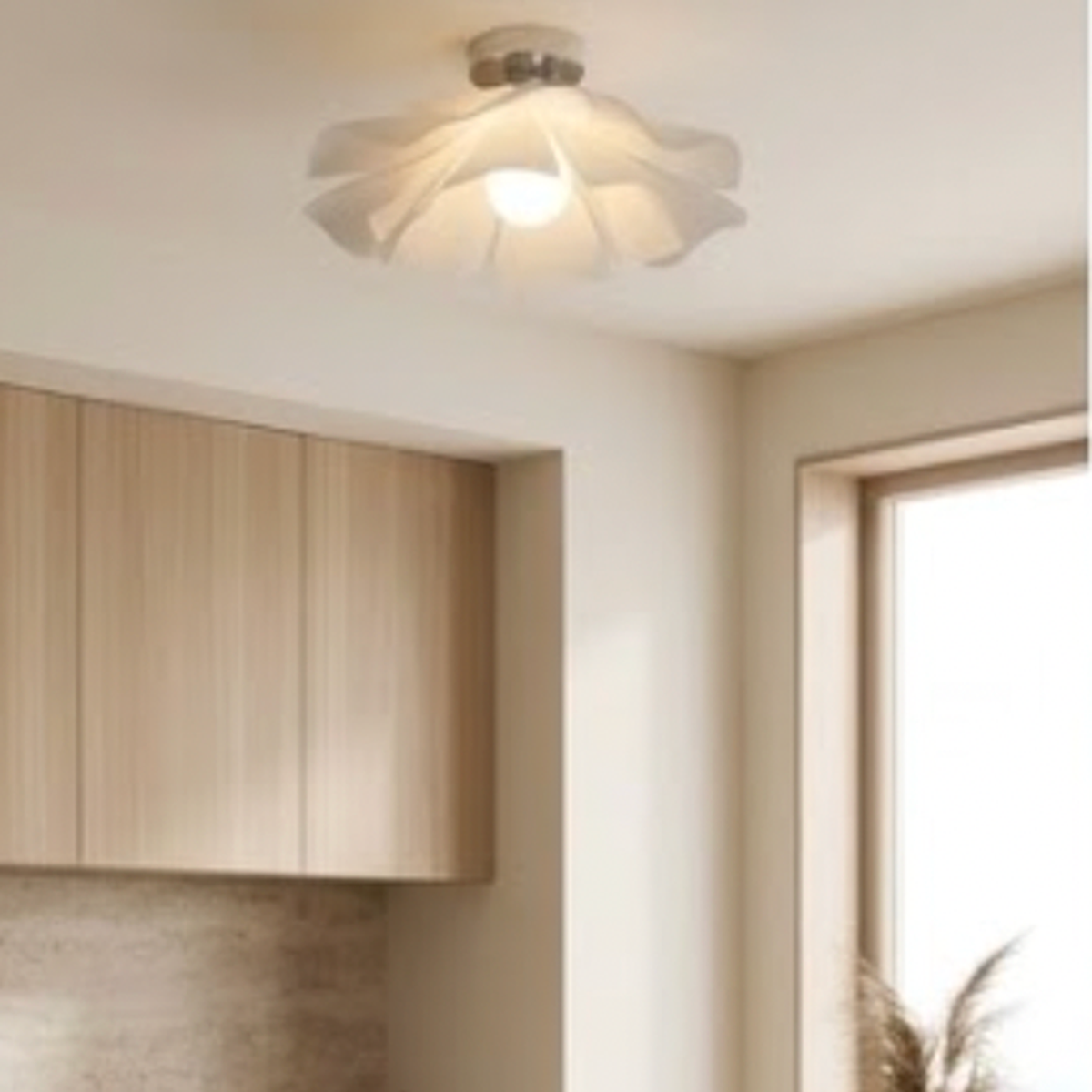Flush mount version of the petal light on a kitchen ceiling with oak cabinets