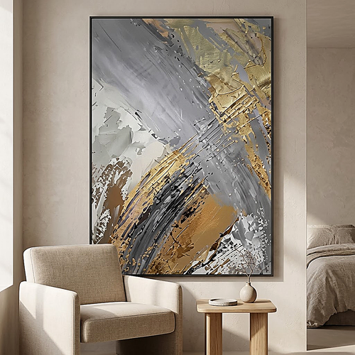 Slate Gold design. Grey and gold diagonal brushwork on canvas, hung beside a linen armchair. Shown framed, sold unframed
