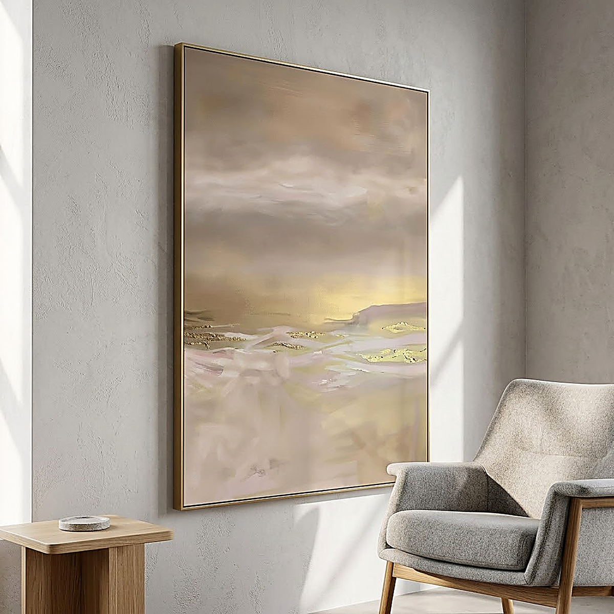 Blush Horizon design. Soft blush, cream and gold horizon on canvas, hung in a corner beside a grey armchair. Shown framed, sold unframed