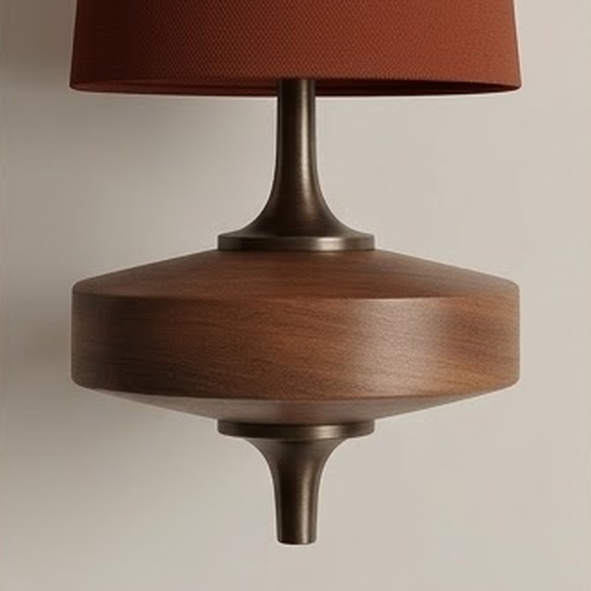 Close view of the rust shade and turned walnut mount seen from below