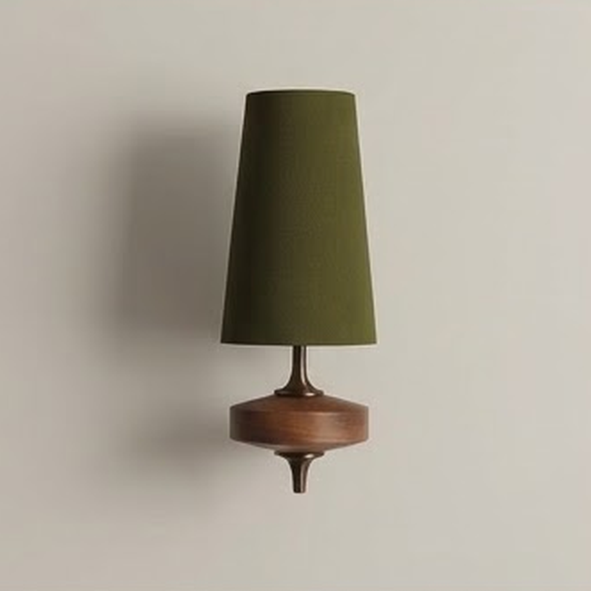 Olive fabric cone wall sconce on a turned walnut base against a pale wall