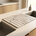Calacatta White stone dish drying mat beside a kitchen sink
