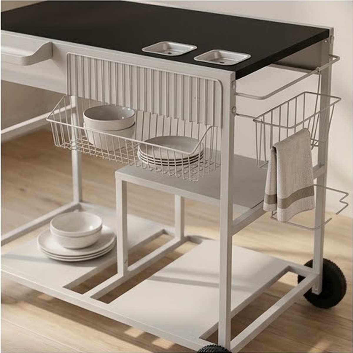 Underside view showing the two hanging wire baskets, the slatted panel and the lower shelf with plates