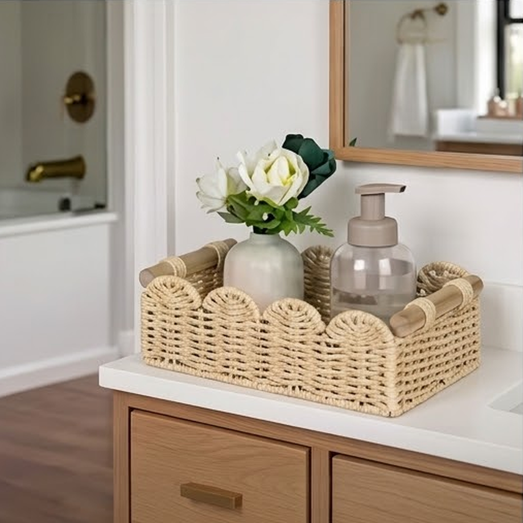 Scalloped basket used on a bathroom vanity holding a soap dispenser and a small vase of flowers